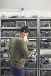 Man working at store with mask