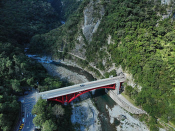 High angle view of bridge over river amidst trees