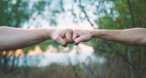 Cropped hand of man holding hands