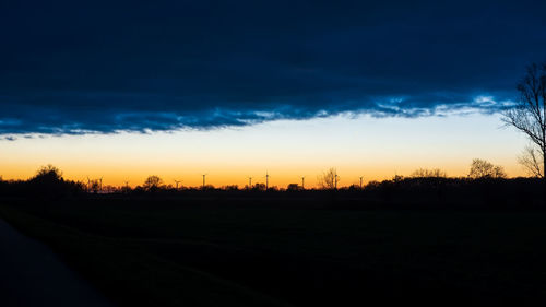 Silhouette landscape against sky during sunset