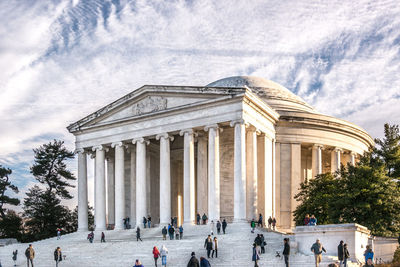 Group of people in front of historical building