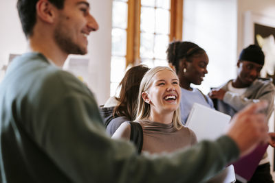 Side view of business colleagues working at office