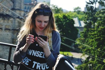 Portrait of beautiful woman in city