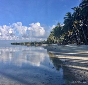 View of beach against cloudy sky