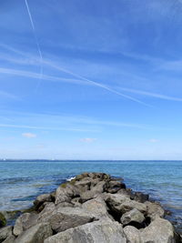 Scenic view of sea against clear blue sky