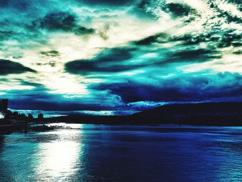 Scenic view of sea against storm clouds
