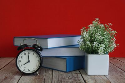 Close-up of clock on table