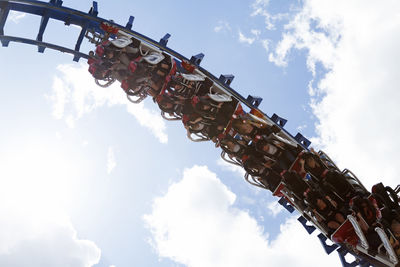 People riding up side down in a roller coaster