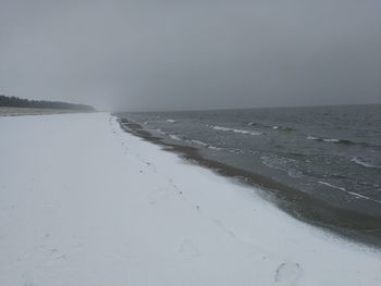 Scenic view of beach against clear sky