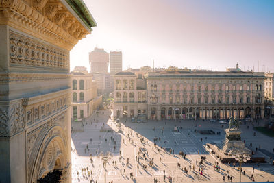 People on street by buildings