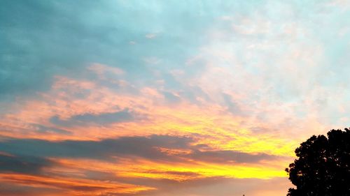 Low angle view of dramatic sky during sunset