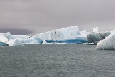 Scenic view of frozen sea against sky