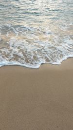 High angle view of surf on beach