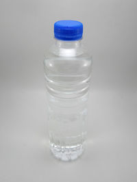 Close-up of water bottle against white background