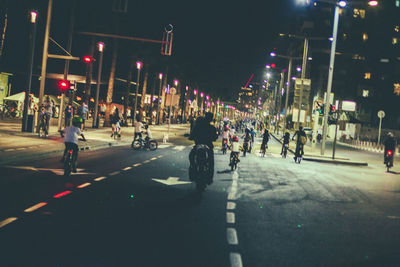 People crossing road at night