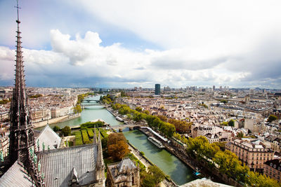 High angle view of river amidst buildings in city