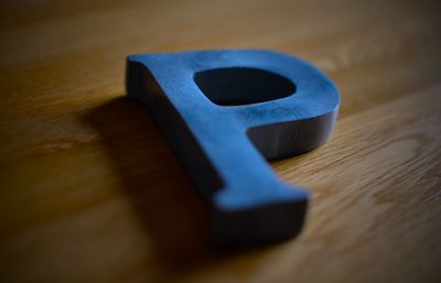 Close-up of letter p on table