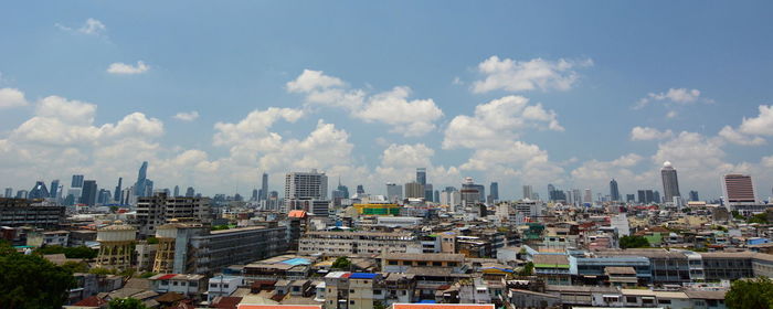 High angle view of buildings in city against sky