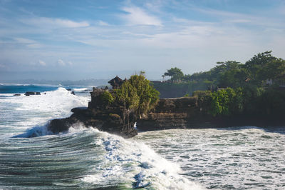 Scenic view of sea against cloudy sky