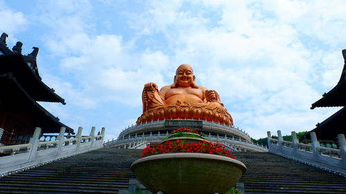 Low angle view of statue against sky