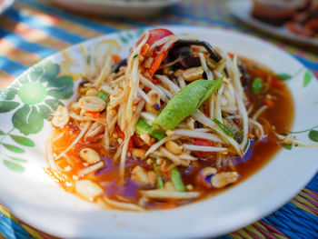 High angle view of meal served in bowl. papaya slad