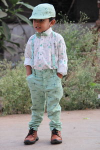 A kid in his fashionable attire with all festive vibes