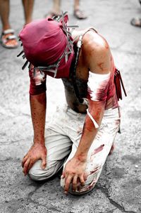 Midsection of man with umbrella