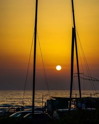 Scenic view of sea against orange sky