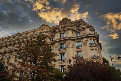 Low angle view of building against sky during sunset