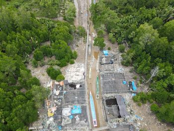 High angle view of road amidst trees in city