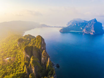 High angle view of sea and rocks against sky
