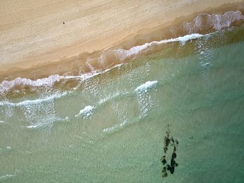 High angle view of waves on beach