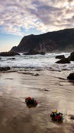 Scenic view of sea against cloudy sky