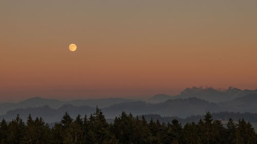 Scenic view of silhouette mountains against sky during sunset