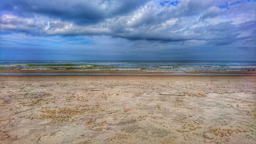 Scenic view of beach against sky