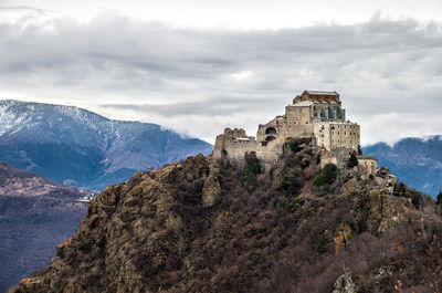 Historic building against cloudy sky