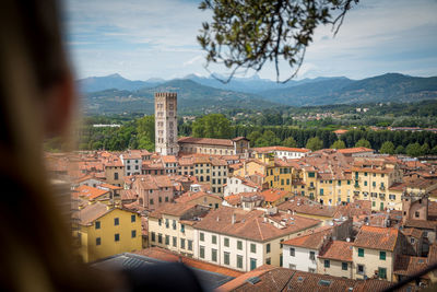 High angle view of townscape and mountains against sky