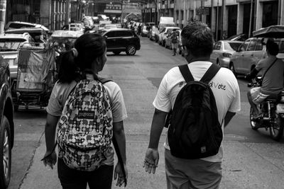 Woman standing on city street