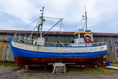 Boats moored at harbor