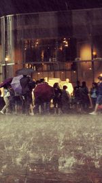 View of illuminated people at night