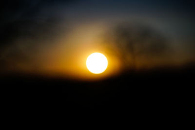 Close-up of orange sun in sky