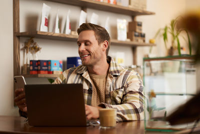 Young man using laptop at home