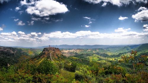 Scenic view of landscape against cloudy sky