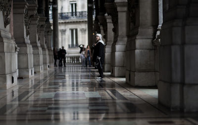 People walking in corridor