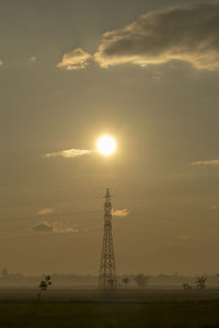 Silhouette landscape against sky during sunset