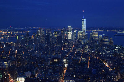 Aerial shot of modern city illuminated at night