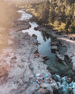 High angle view of river flowing through rocks