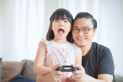 Portrait of smiling woman using mobile phone
