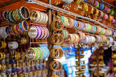 Multi colored candies bangles hanging for sale in store