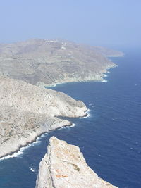 Scenic view of mountains against blue sky